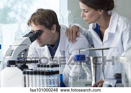 Scientists working in laboratory View Large Photo Image Stock Photo - Scientists working in laboratory. Fotosearch