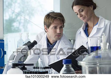 Scientists working together in laboratory View Large Photo Image Stock Photo - Scientists working together in laboratory. Fotosearch