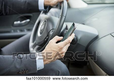 Text-messaging while driving View Large Photo Image Stock Photo - Text-messaging while driving. Fotosearch