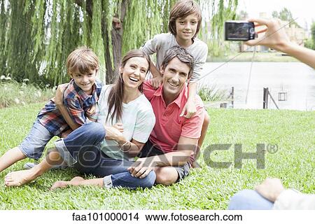 Picture - "Using digital camera to photograph family, personal perspective". Fotosearch
