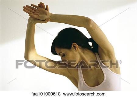 Stock Photo - "Woman stretching, arms in air". Fotosearch