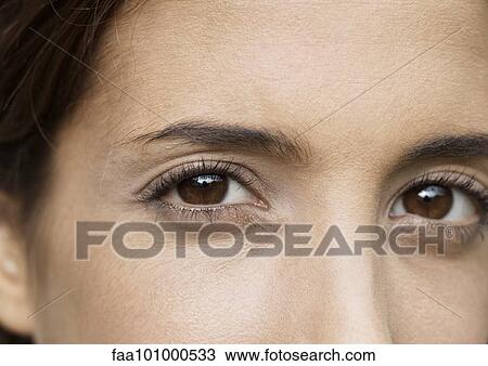 Stock Image - "Woman with brown eyes, extreme close-up". Fotosearch