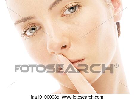Woman with finger over lips View Large Photo Image Stock Photography - Woman with finger over lips. Fotosearch