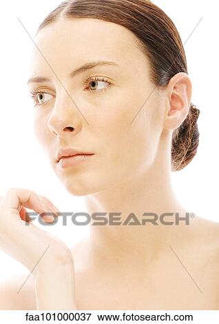 Stock Photo - "Woman with hair back, looking away, portrait". Fotosearch