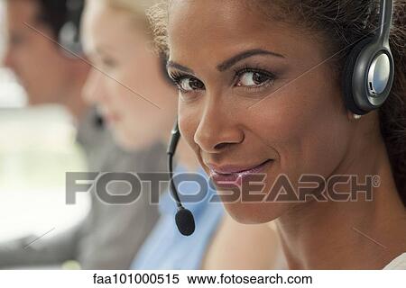 "Woman working in call center, smiling confidently" View Large Photo Image Stock Photography - "Woman working in call center, smiling confidently". Fotosearch