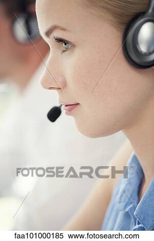 Stock Photography - Woman working in call center. Fotosearch