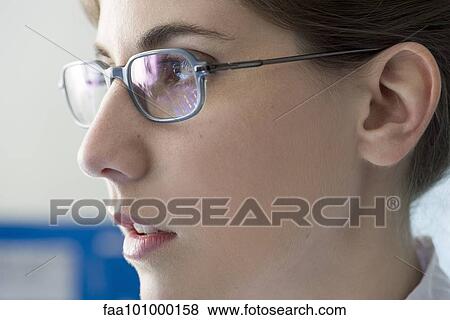 "Young woman in glasses looking away in thought, profile" View Large Photo Image Stock Photo - "Young woman in glasses looking away in thought, profile". Fotosearch