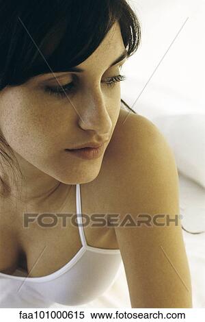 "Young woman in tank top looking away, portrait" View Large Photo Image Stock Photography - "Young woman in tank top looking away, portrait". Fotosearch