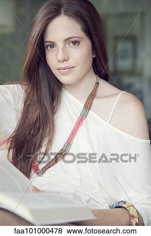 "Young woman relaxing with book, portrait" View Large Photo Image Stock Photo - "Young woman relaxing with book, portrait". Fotosearch