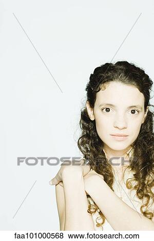 "Young woman with hands clasped on shoulder, portrait" View Large Photo Image Stock Photo - "Young woman with hands clasped on shoulder, portrait". Fotosearch