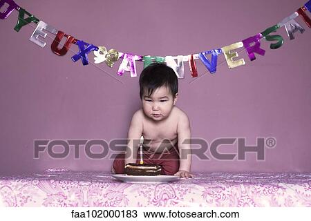 Baby blowing out birthday candle View Large Photo Image Stock Image - Baby blowing out birthday candle. Fotosearch
