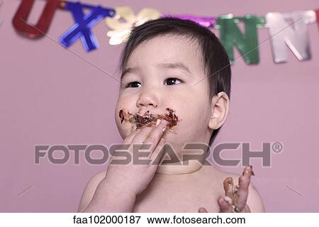 Baby eating birthday cake View Large Photo Image Stock Photo - Baby eating birthday cake. Fotosearch