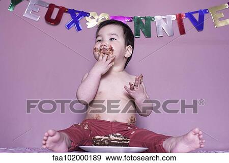 Baby eating birthday cake View Large Photo Image Stock Photo - Baby eating birthday cake. Fotosearch