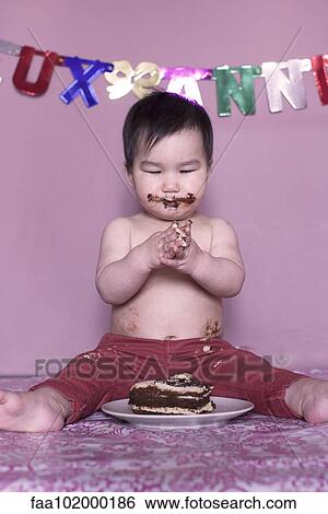 Baby eating birthday cake View Large Photo Image Stock Photograph - Baby eating birthday cake. Fotosearch
