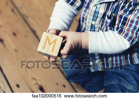 "Baby playing with abc blocks, cropped" View Large Photo Image Stock Photograph - "Baby playing with abc blocks, cropped". Fotosearch