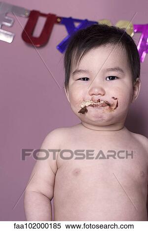 Baby with dirty face after eating cake View Large Photo Image Stock Photography - Baby with dirty face after eating cake. Fotosearch