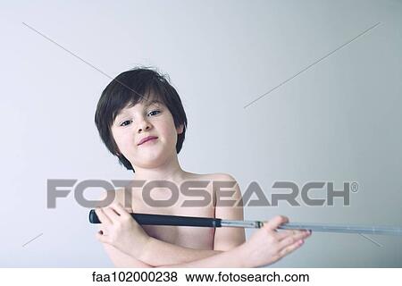 "Boy playing with toy sword, portrait" View Large Photo Image Stock Photo - "Boy playing with toy sword, portrait". Fotosearch