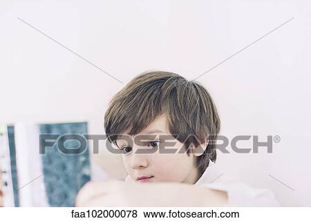 Boy reading book View Large Photo Image Stock Photo - Boy reading book. Fotosearch
