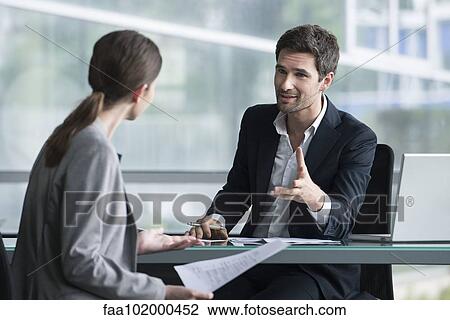 Stock Image - Businessman meeting with client. Fotosearch