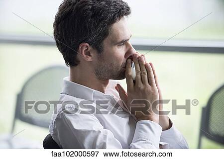 Businessman weighing important decision View Large Photo Image Stock Photo - Businessman weighing important decision. Fotosearch