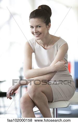 "Businesswoman sitting with arms folded, portrait" View Large Photo Image Stock Photo - "Businesswoman sitting with arms folded, portrait". Fotosearch