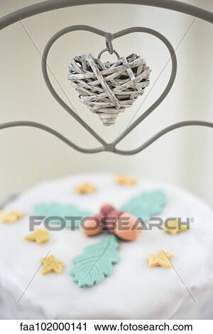 Cake on stand with heart shaped decoration View Large Photo Image Stock Image - Cake on stand with heart shaped decoration. Fotosearch