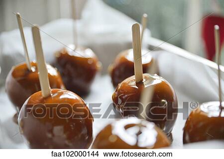 Caramel apples View Large Photo Image Picture - Caramel apples. Fotosearch