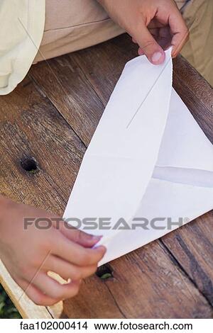 "Child folding paper, cropped" View Large Photo Image Picture - "Child folding paper, cropped". Fotosearch