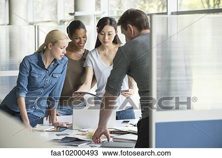 Colleagues selecting color swatches View Large Photo Image Stock Image - Colleagues selecting color swatches. Fotosearch