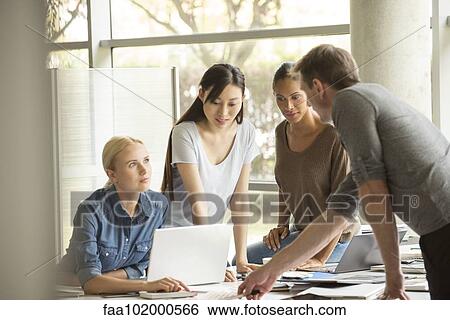 Colleagues sharing ideas View Large Photo Image Stock Photograph - Colleagues sharing ideas. Fotosearch