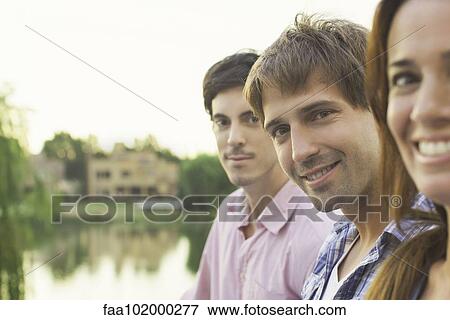 Stock Photo - College friends together at scenic location. Fotosearch