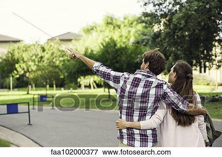 Stock Photo - Couple enjoying walk together. Fotosearch