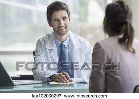 Doctor meeting with patient View Large Photo Image Stock Photo - Doctor meeting with patient. Fotosearch