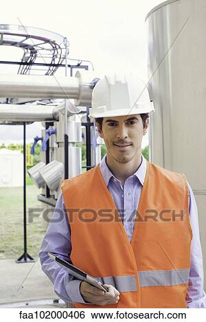 Engineer at industrial site View Large Photo Image Stock Photograph - Engineer at industrial site. Fotosearch