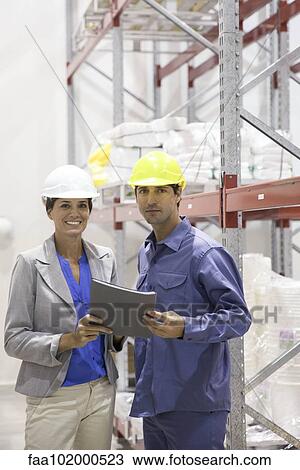 "Engineers in warehouse, portrait" View Large Photo Image Stock Image - "Engineers in warehouse, portrait". Fotosearch