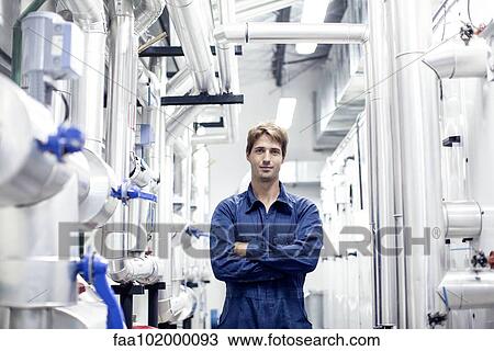 Stock Image - "Factory worker in industrial plant, portrait". Fotosearch