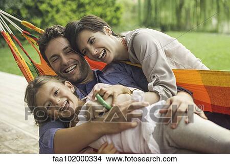 Family playing on hammock View Large Photo Image Picture - Family playing on hammock. Fotosearch