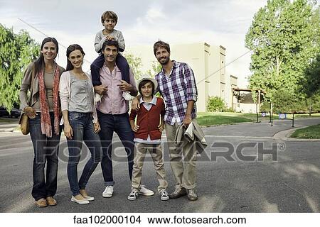 Family posing for group portrait outdoors View Large Photo Image Picture - Family posing for group portrait outdoors. Fotosearch
