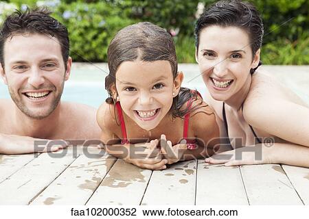 "Family relaxing together in pool, portrait" View Large Photo Image Stock Image - "Family relaxing together in pool, portrait". Fotosearch