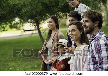 Stock Photo - Family spending time together outdoors. Fotosearch