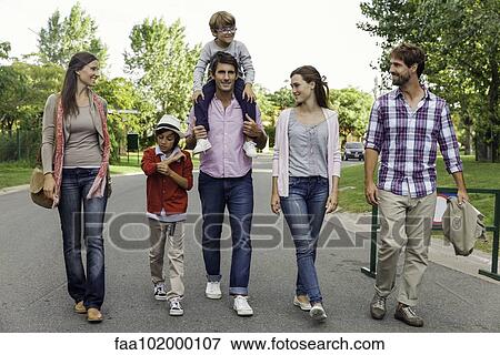 Family walking together in street View Large Photo Image Stock Photo - Family walking together in street. Fotosearch