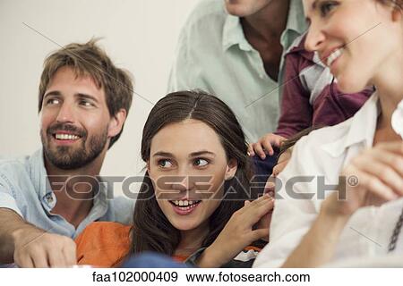 Stock Photo - Family watching TV together. Fotosearch