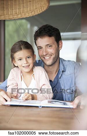 "Father and daughter reading together, portrait" View Large Photo Image Stock Photography - "Father and daughter reading together, portrait". Fotosearch