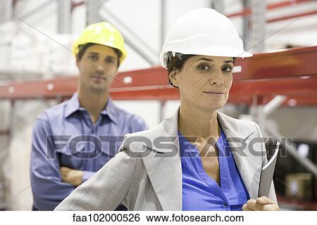 "Female supervisor at industrial site, portrait" View Large Photo Image Stock Photograph - "Female supervisor at industrial site, portrait". Fotosearch