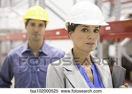 Stock Photography - "Female supervisor at industrial site, portrait". Fotosearch