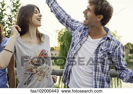 Friends dancing together outdoors View Large Photo Image Stock Image - Friends dancing together outdoors. Fotosearch