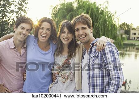 Friends posing for group photo View Large Photo Image Stock Image - Friends posing for group photo. Fotosearch