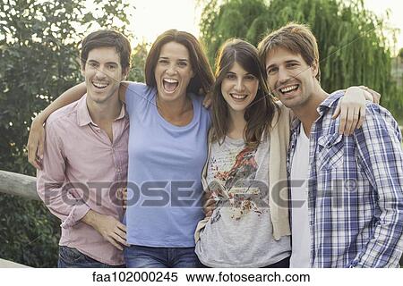 Friends posing together for group photo View Large Photo Image Stock Photography - Friends posing together for group photo. Fotosearch