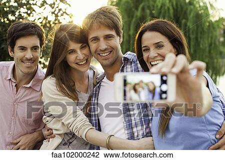 Friends taking group selfie View Large Photo Image Stock Image - Friends taking group selfie. Fotosearch
