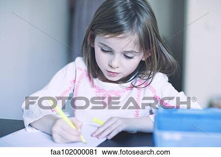 Girl drawing in notebook View Large Photo Image Stock Image - Girl drawing in notebook. Fotosearch